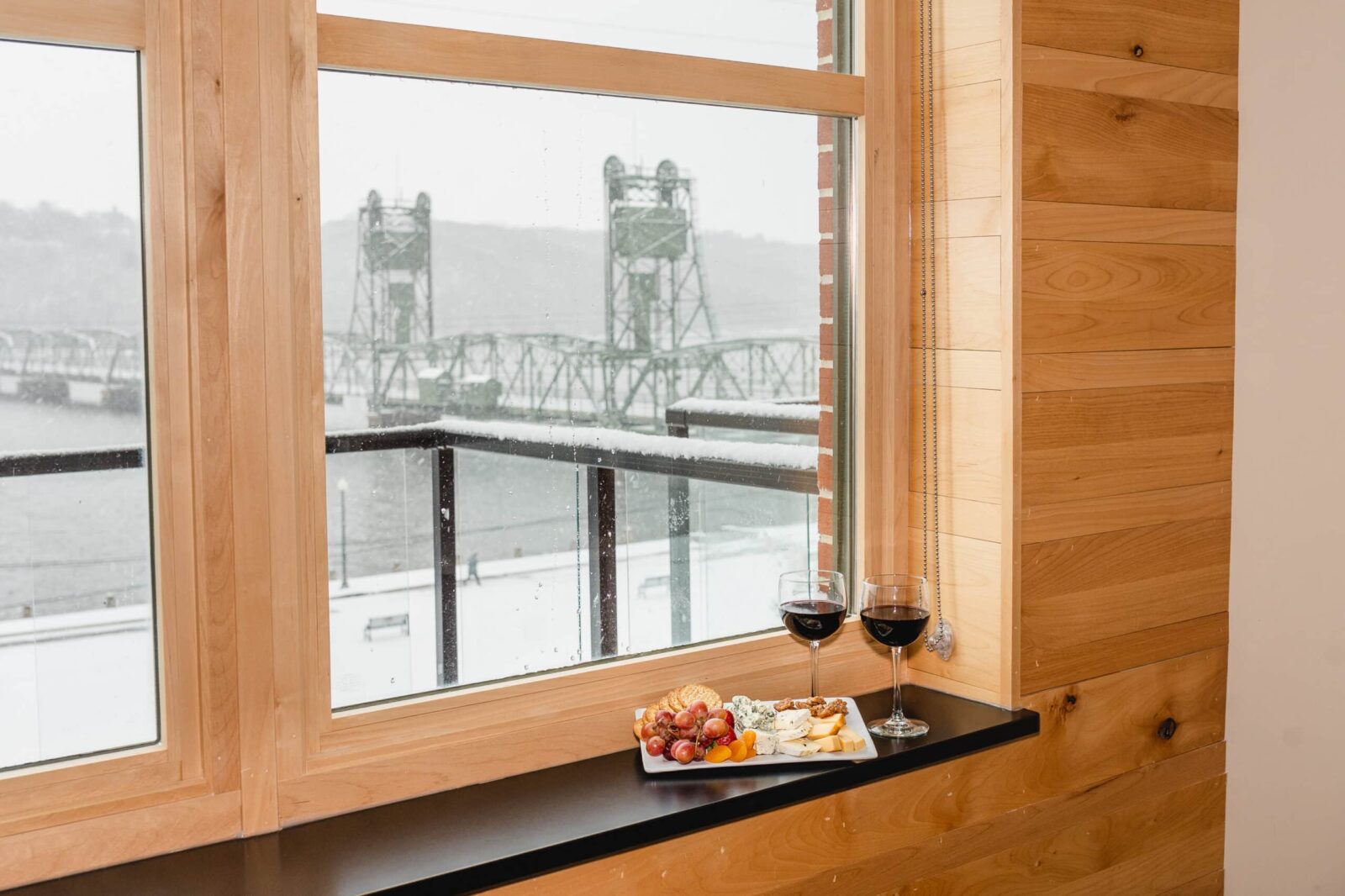 Views of the Historic Lift Bridge, wine and cheese plate at Romantic Hotels in MN